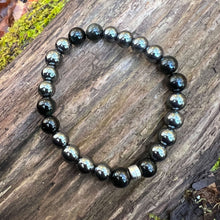 Load image into Gallery viewer, Hematite and Black Obsidian Bead Bracelet This bracelet is made with high-quality Hematite and Black Obsidian stones which bring balance and self-awareness to the wearer. Zodiac Signs: Aquarius, Aries, and Scorpio. Chakras: Root. Handmade with authentic c
