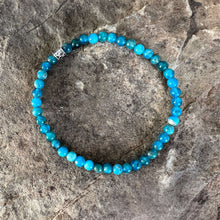 Load image into Gallery viewer, Apatite Bead Bracelet This bracelet is made with high-quality Apatite stones which bring clarity to the wearer. Zodiac Signs: Gemini and Libra. Chakra: Third Eye and Throat. Handmade with authentic crystals and gemstones in Minneapolis, MN.
