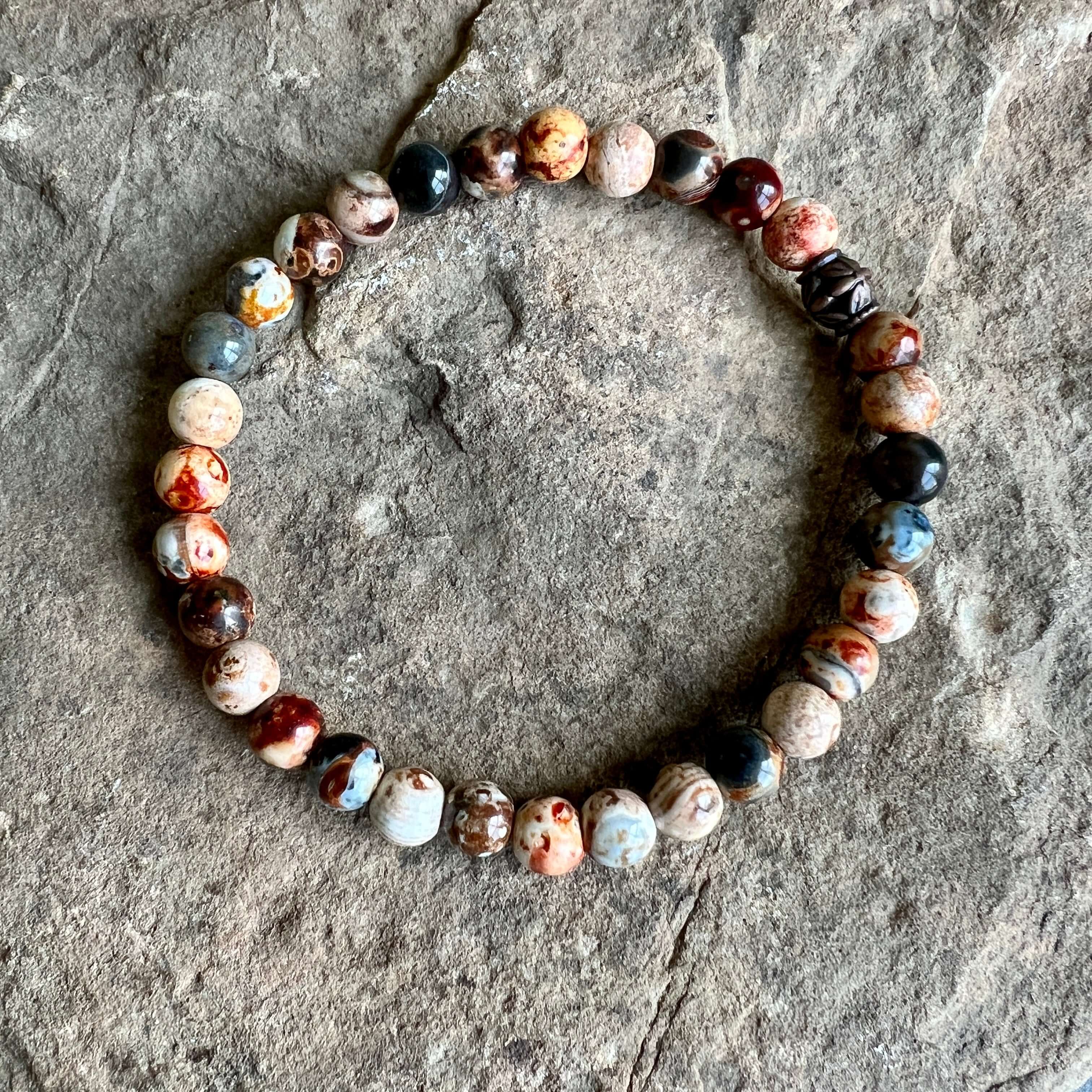 Ancient Cellar Agate Bracelets These bracelets are made with high-quality Ancient Cellar Agate beads which bring stability and clarity to the wearer. Zodiac: Gemini & Virgo Chakras: Third Eye, Root, Crown & Heart. Handmade with authentic crystals and gems