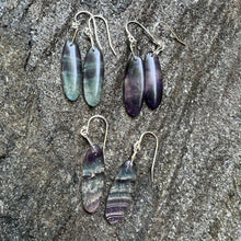 Load image into Gallery viewer, Fluorite Earrings - Oval These earrings are made with high-quality Fluorite gemstones which bring grounding and harmony to the wearer. Fluorite is a protective and stabilizing stone which is perfect for grounding and harmonizing spiritual energy. It can a
