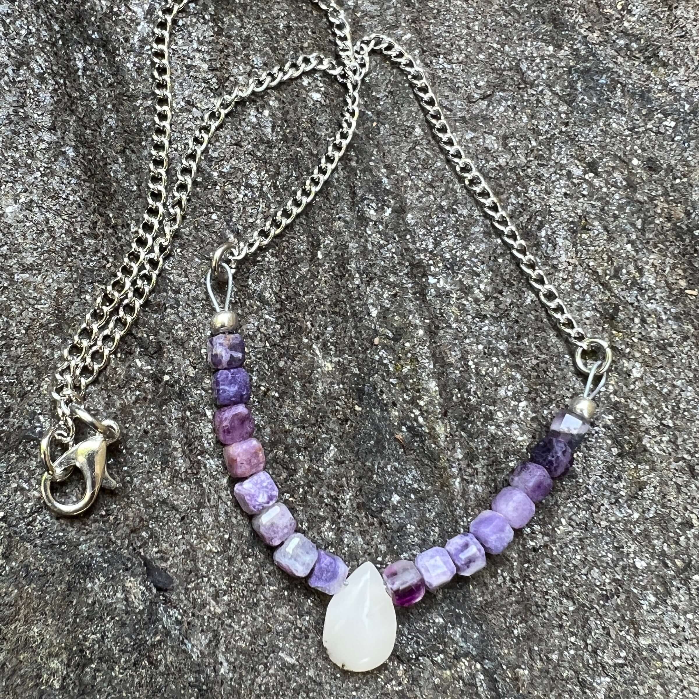 Opal and Fluorite Necklace This necklace is made with high-quality Opal and Fluorite gemstones which bring healing and cleansing energy to the wearer. Zodiac: Pisces, Capricorn & Libra Chakras: Crown, Third Eye & Sacral. Handmade with authentic crystals a