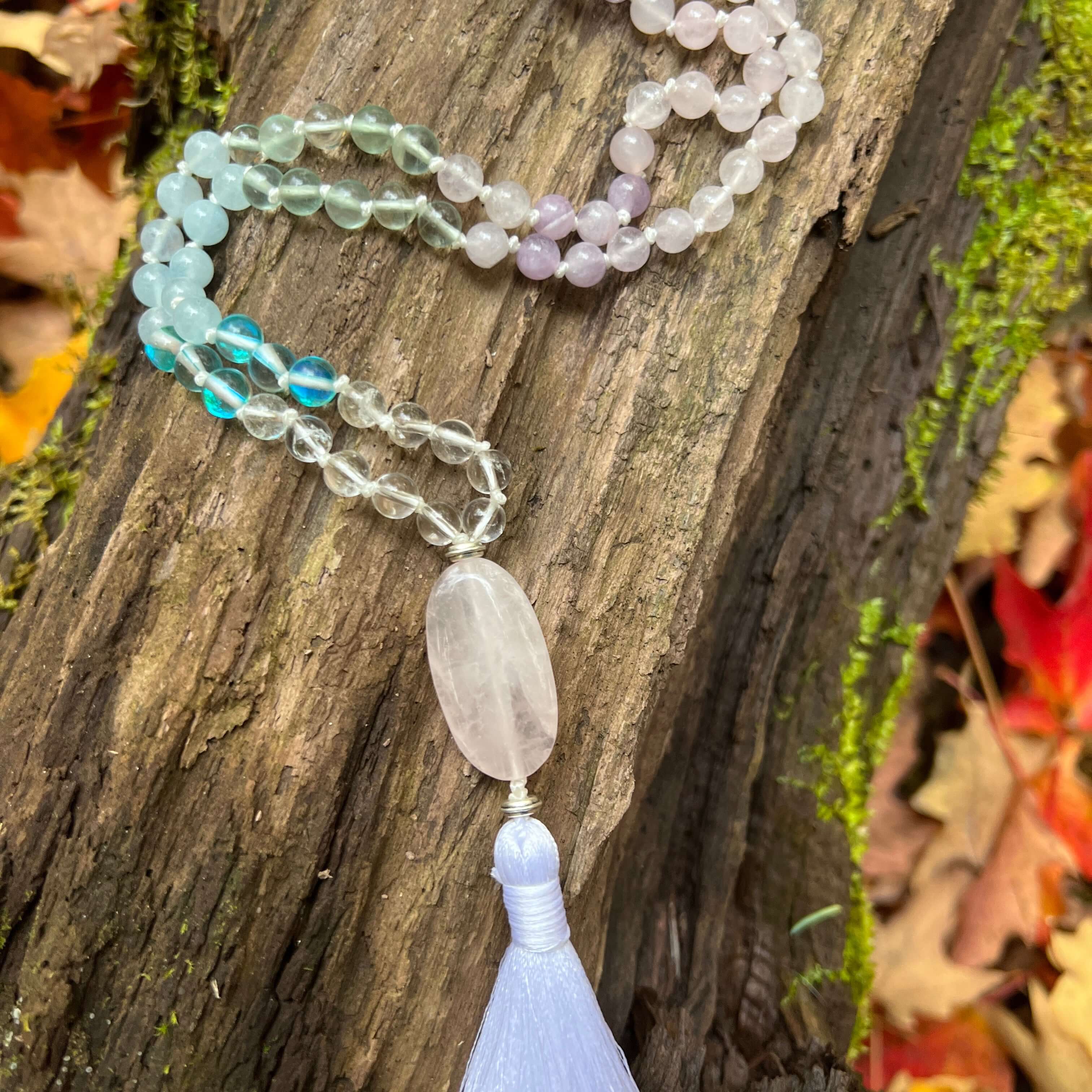 Clarity Mala with a woodland background.