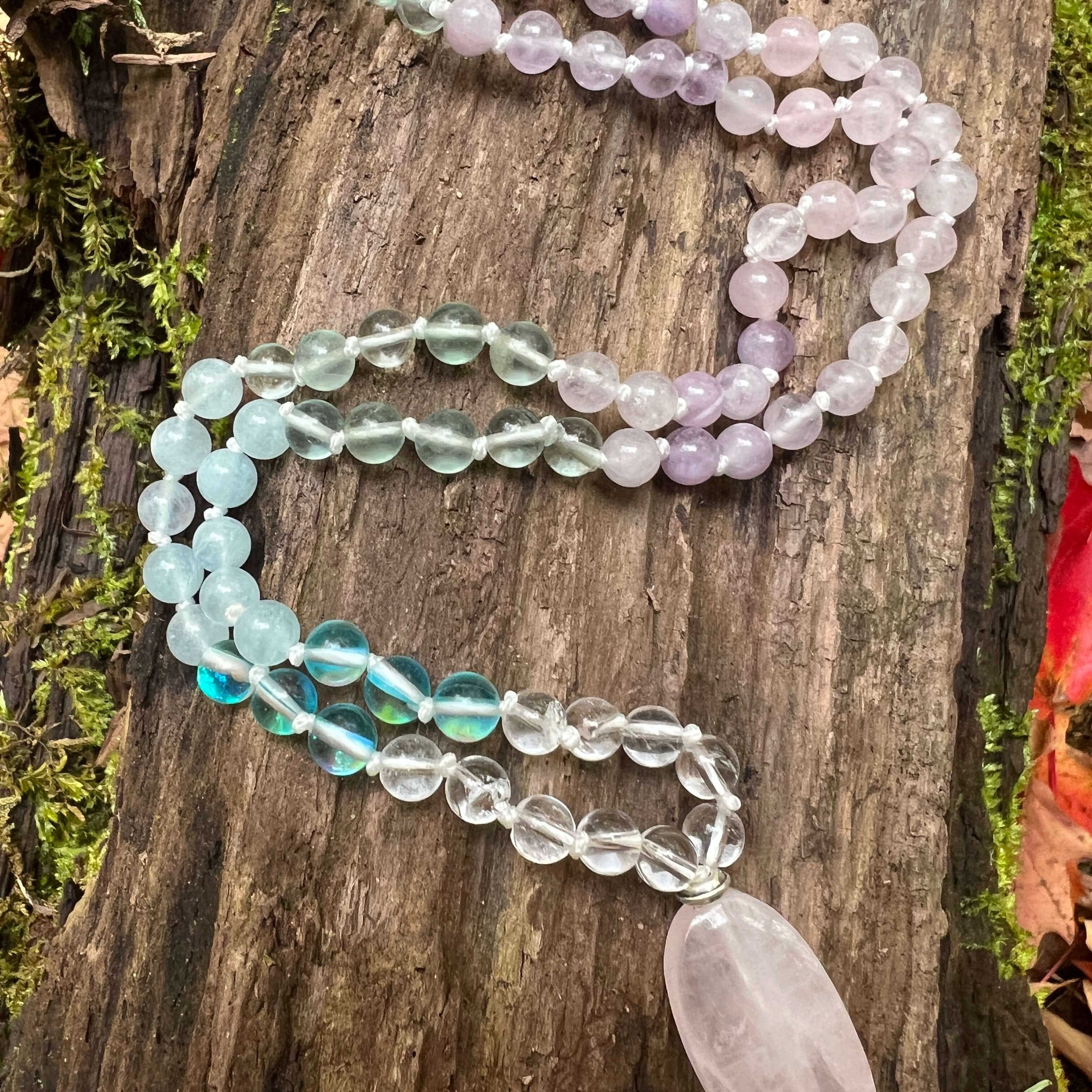 Clarity Mala with a woodland background.
