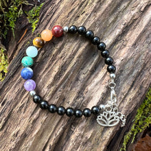Load image into Gallery viewer, Obsidian Chakra Bracelet This bracelet is made with black obsidian, and chakra stones with a lotus charm. These stones together help the wearer balance the energy of their chakras. Stones include Jasper, Aventurine, Moonstone, Turquoise, Sodalite, Amethys
