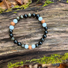 Load image into Gallery viewer, Golden Obsidian, Sandalwood, and White Jade Bracelet This bracelet is made with high quality Golden Obsidian, aromatic Sandalwood, and White Jade. Golden Obsidian and Sandalwood dissolves negativity, purifies the aura, and heals the solar plexus chakra wh

