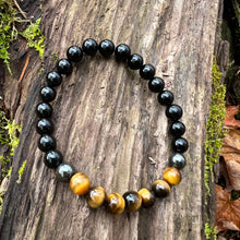 Load image into Gallery viewer, Triple Protection Obsidian, Tiger Eye, and Hematite Bracelet This bracelet is made with Black Obsidian, Tiger Eye, and Hematite. These stones together brings the wearer protection against negative energy of all kinds- inner, spiritual, and environmental.
