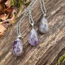 Load image into Gallery viewer, Amethyst Teardrop Necklace This necklace is made with high-quality Amethyst which brings calm and balance to the wearer. Zodiac: Pisces &amp; Aquarius Chakras: Third Eye, Crown, All. Handmade with authentic crystals and gemstones in Minneapolis, MN.
