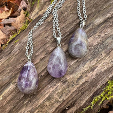 Load image into Gallery viewer, Amethyst Teardrop Necklace This necklace is made with high-quality Amethyst which brings calm and balance to the wearer. Zodiac: Pisces &amp; Aquarius Chakras: Third Eye, Crown, All. Handmade with authentic crystals and gemstones in Minneapolis, MN.
