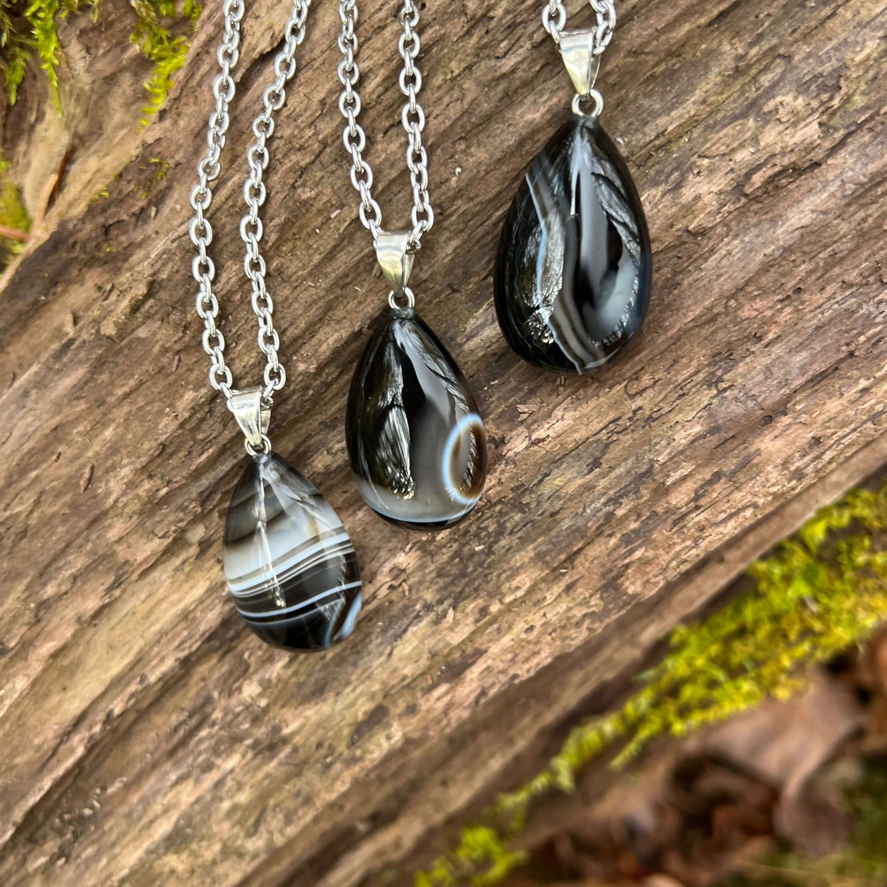 Tuxedo Agate Teardrop Necklace This necklace is made with a high-quality Tuxedo Agate stone which brings stability and release to the wearer. Zodiac: Gemini & Virgo Chakras: Third Eye, Root, Crown & Heart. Handmade with authentic crystals and gemstones.
