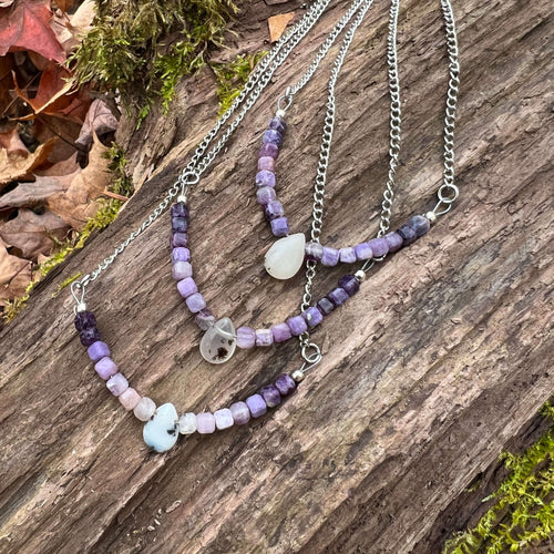 Opal and Fluorite Necklace This necklace is made with high-quality Opal and Fluorite gemstones which bring healing and cleansing energy to the wearer. Zodiac: Pisces, Capricorn & Libra Chakras: Crown, Third Eye & Sacral. Handmade with authentic crystals a