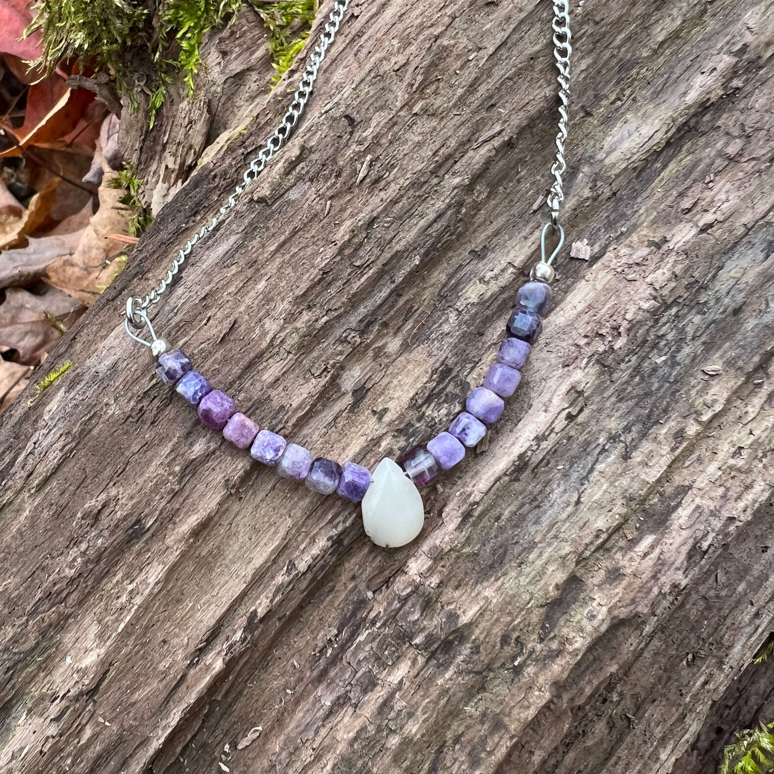 Opal and Fluorite Necklace This necklace is made with high-quality Opal and Fluorite gemstones which bring healing and cleansing energy to the wearer. Zodiac: Pisces, Capricorn & Libra Chakras: Crown, Third Eye & Sacral. Handmade with authentic crystals a
