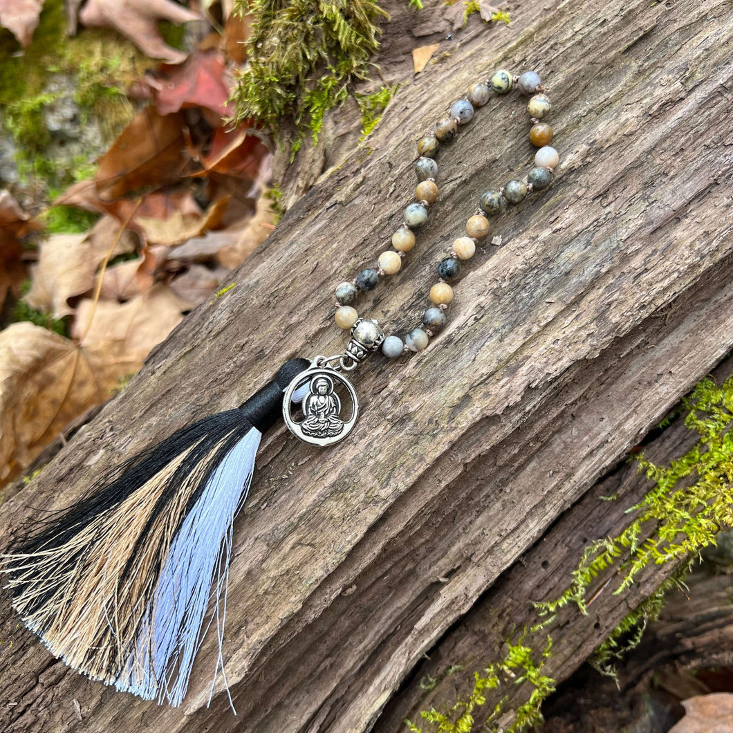 Black Moss Opal Wrist Mala This mala is made with authentic Black Moss Opal gemstones, which provide inspiration and prosperity for the wearer. Zodiac Signs: Scorpio & Libra. Chakras: Root. Handmade with authentic crystals and gemstones in Minneapolis, MN