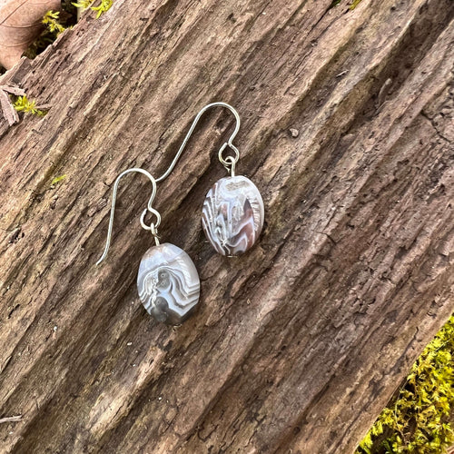 Botswana Agate Earrings These earrings are made with high-quality Botswana Agate stones which bring comfort to the wearer. Zodiac Sign: Gemini. Chakra: Root. Handmade with authentic crystals and gemstones in Minneapolis, MN.