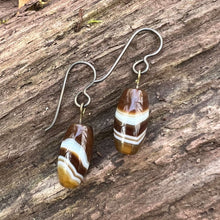 Load image into Gallery viewer, Tibetan Agate Earrings These earrings are made with authentic Tibetan Agate gemstones, which is believed to bestow its wearer with a sense of balance and protection, shielding you from negative energies while enhancing your inner strength and resilience.
