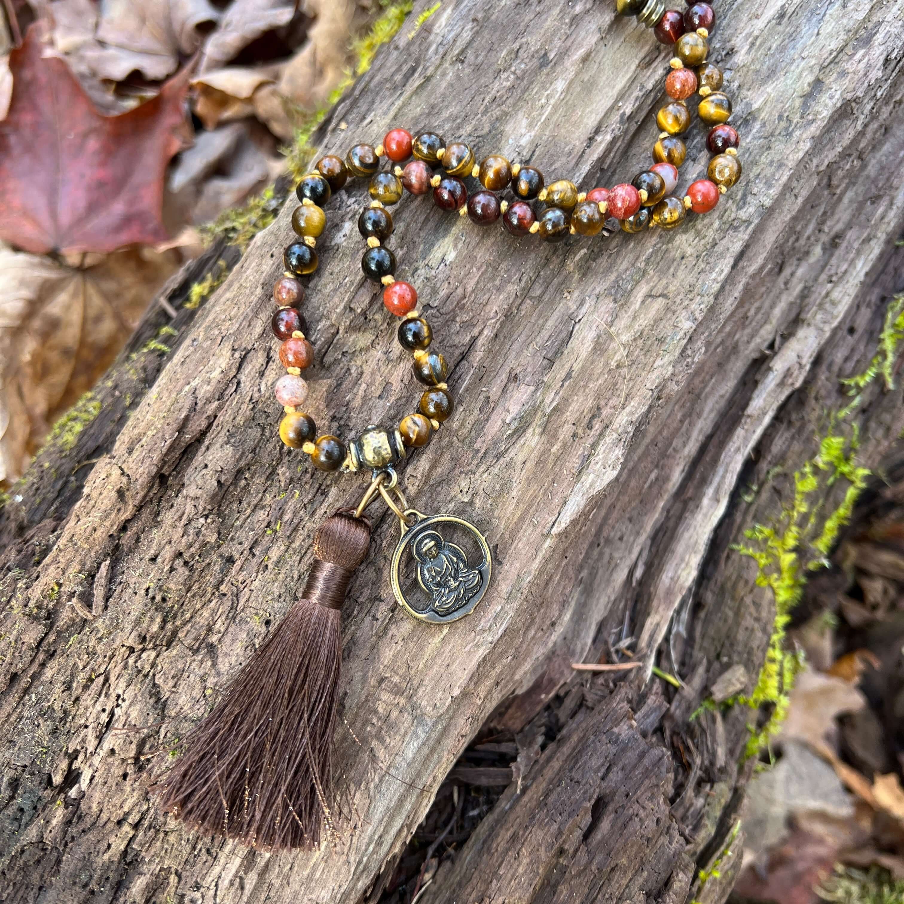 Tiger Eye Mala This mala is made with brown Tiger Eye, Red Tiger Eye, and Mookaite stones which bring a stable, grounding energy to the wearer. Due to the uniqueness of natural stone, your mala may look slightly different than the one pictured. Making you