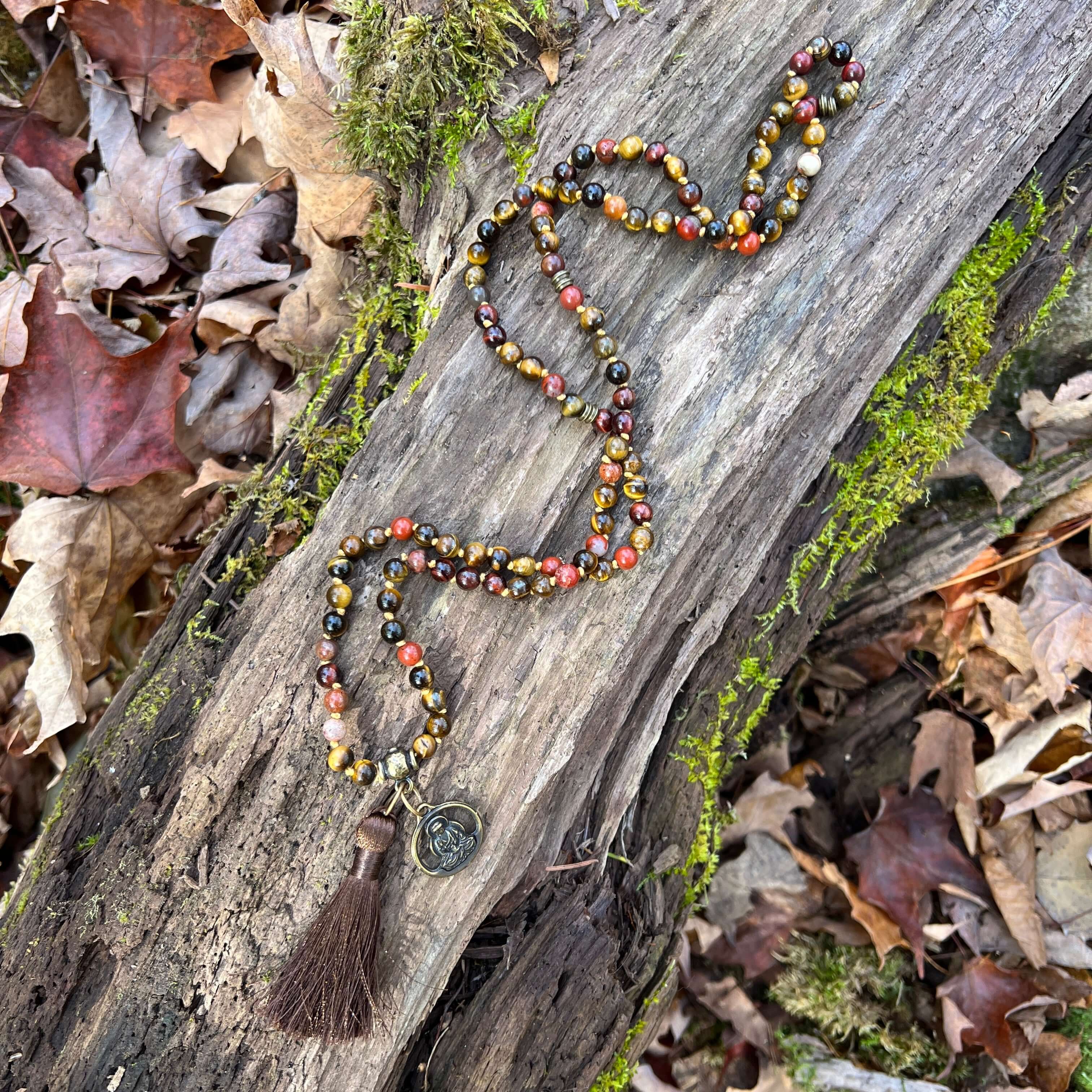 Tiger Eye Mala This mala is made with brown Tiger Eye, Red Tiger Eye, and Mookaite stones which bring a stable, grounding energy to the wearer. Due to the uniqueness of natural stone, your mala may look slightly different than the one pictured. Making you