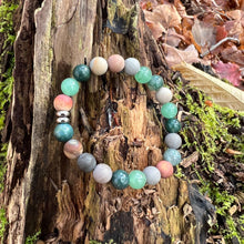 Load image into Gallery viewer, Earth Harmony Bracelet Our Earth Harmony Bracelet fuses the energies of Polychrome Jasper, Moss Agate, and Green Aventurine, which brings the wearer a sense of emotional balance, inner growth, and grounding energy.

