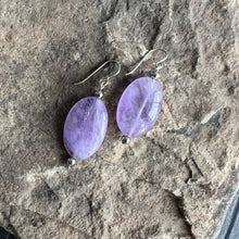 Load image into Gallery viewer, Lavender Amethyst Earrings These earrings are made with high-quality Amethyst stones which bring serenity to the wearer. Amethyst is a stone of serenity. This stone helps to calm the mind. It was once known as a “Gem of Fire” by ancient cultures. It has b
