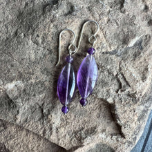 Load image into Gallery viewer, Amethyst Eye Earrings This bracelet is made with high-quality Amethyst stones which bring serenity to the wearer. Amethyst is a stone of serenity. It has been greatly sought after throughout history and was at times valued as highly as Diamond. Today, thi
