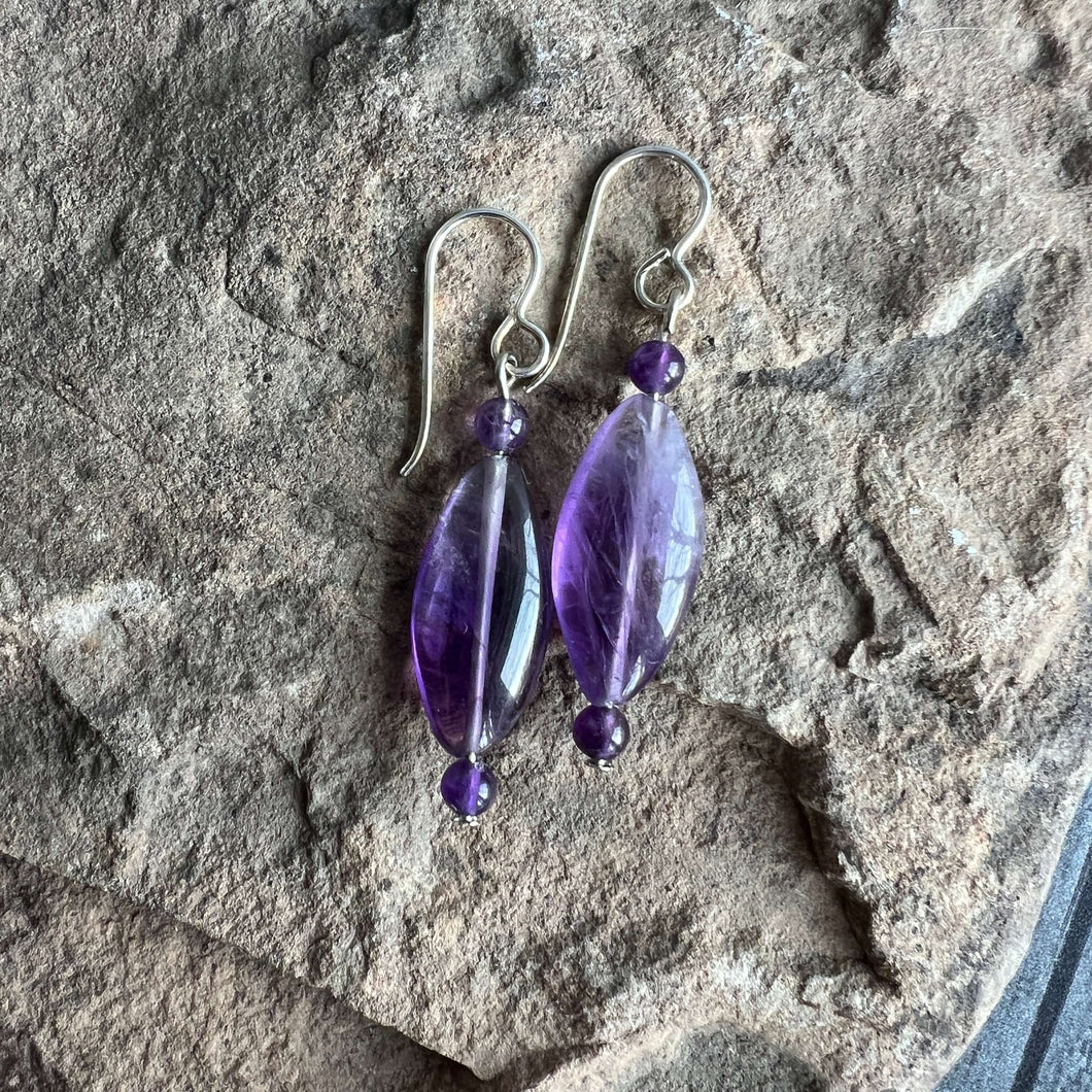 Amethyst Eye Earrings This bracelet is made with high-quality Amethyst stones which bring serenity to the wearer. Amethyst is a stone of serenity. It has been greatly sought after throughout history and was at times valued as highly as Diamond. Today, thi