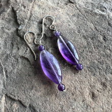 Load image into Gallery viewer, Amethyst Eye Earrings This bracelet is made with high-quality Amethyst stones which bring serenity to the wearer. Amethyst is a stone of serenity. It has been greatly sought after throughout history and was at times valued as highly as Diamond. Today, thi
