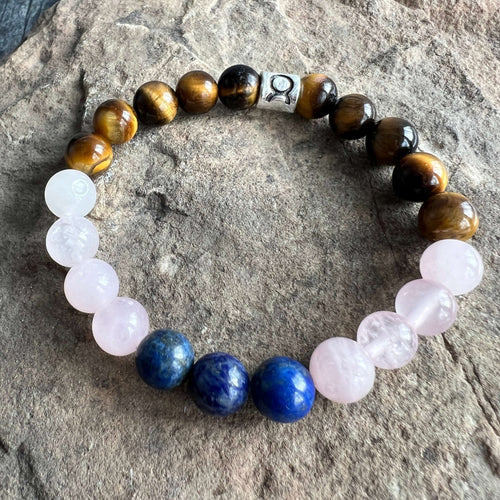 Taurus Zodiac Bracelet The Taurus Zodiac Bracelet is created with a combination of Rose Quartz, Lapis Lazuli, and Tiger Eye beads which resonate with the grounded and sensual qualities associated with this zodiac sign.