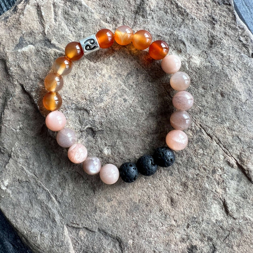 Cancer Zodiac Bracelet The Cancer Zodiac Bracelet is created with a combination of Carnelian, Moonstone, and Lava beads, which resonate with the sensitive, nurturing qualities associated with this zodiac sign.