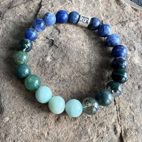 Virgo Zodiac Bracelet The Virgo Zodiac Bracelet is created with a combination of Moss Agate, Amazonite, and Sodalite beads which resonate with the practical and analytical qualities associated with this zodiac sign.