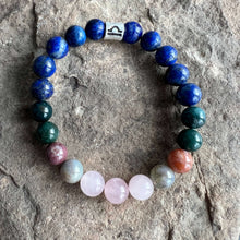 Load image into Gallery viewer, Libra Zodiac Bracelet The Libra Zodiac Bracelet is created with a combination of Rose Quartz, Agate and Lapis beads, which resonate with the graceful and harmonious qualities associated with this zodiac sign.
