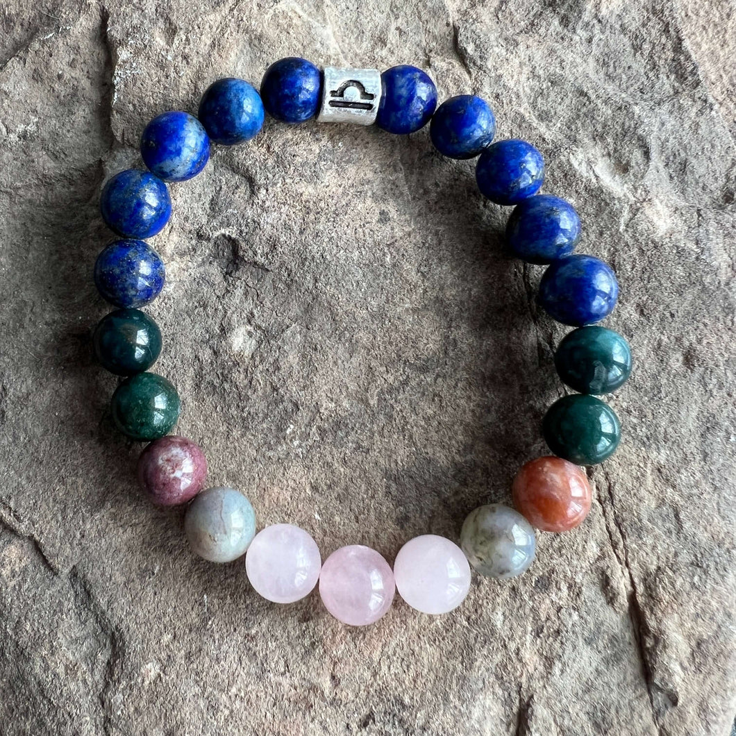 Libra Zodiac Bracelet The Libra Zodiac Bracelet is created with a combination of Rose Quartz, Agate and Lapis beads, which resonate with the graceful and harmonious qualities associated with this zodiac sign.