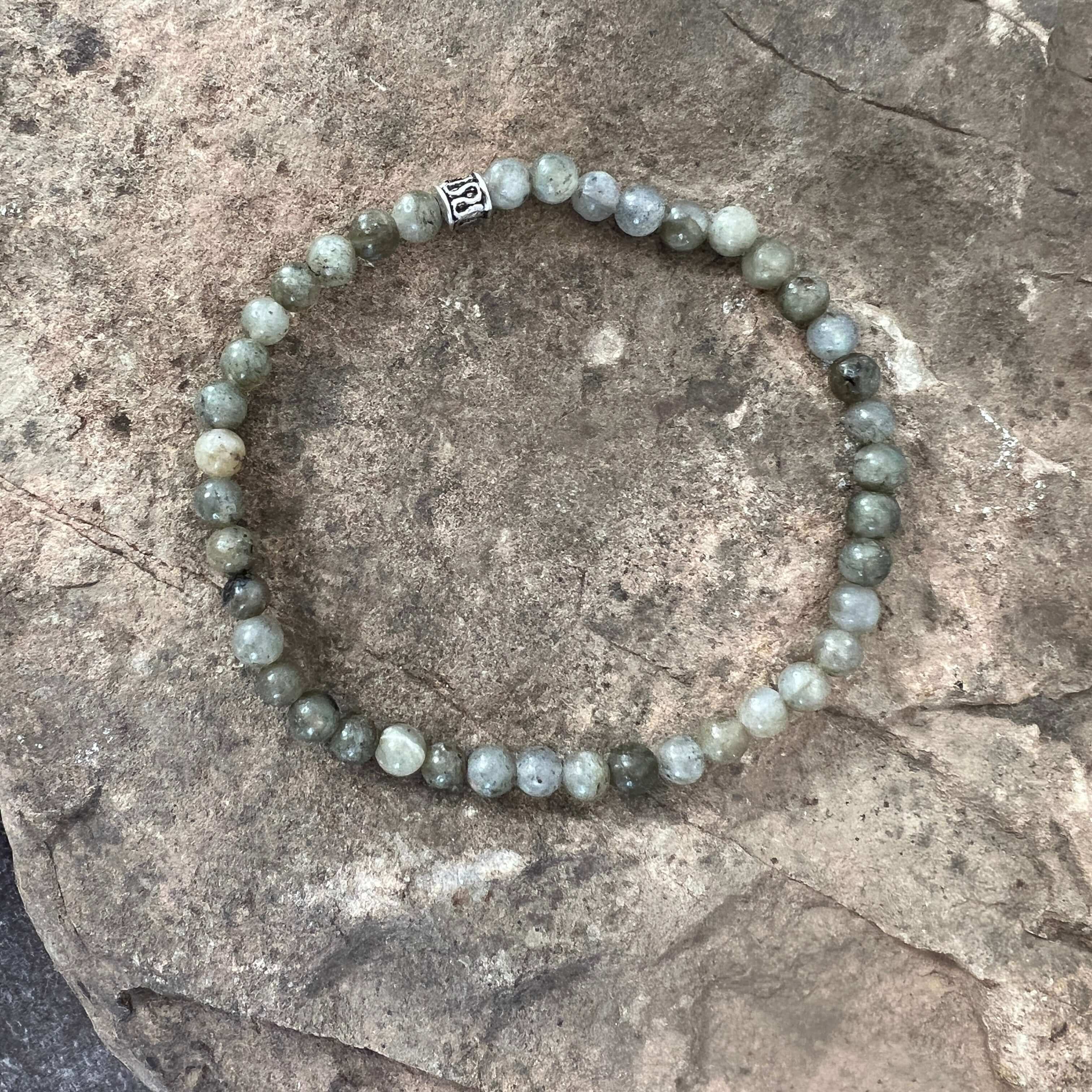 Labradorite Bracelet This bracelet is made with high-quality Labradorite gemstones which provide support and perseverance during times of change. Zodiac Signs: Sagittarius, Scorpio & Leo Chakras: Third Eye & Crown. Handmade with authentic crystals and gem