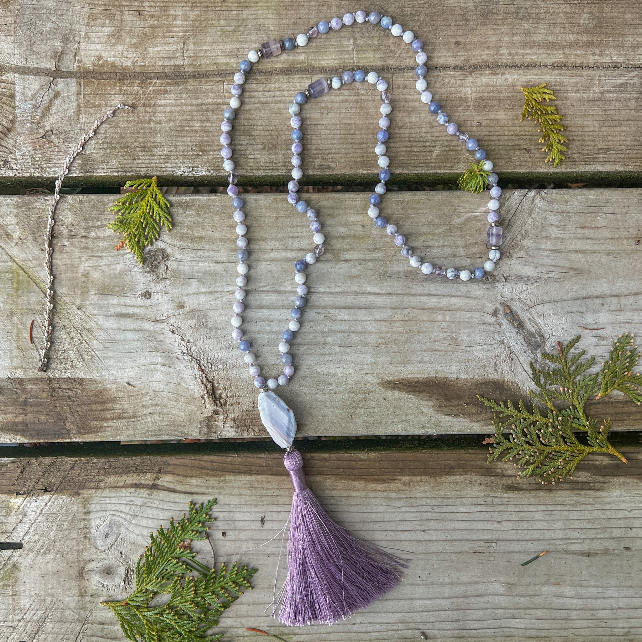 Handcrafted Morning Light Meditation Mala with 108 gemstones, Botswana Agate focal stone, and lavender tassel.