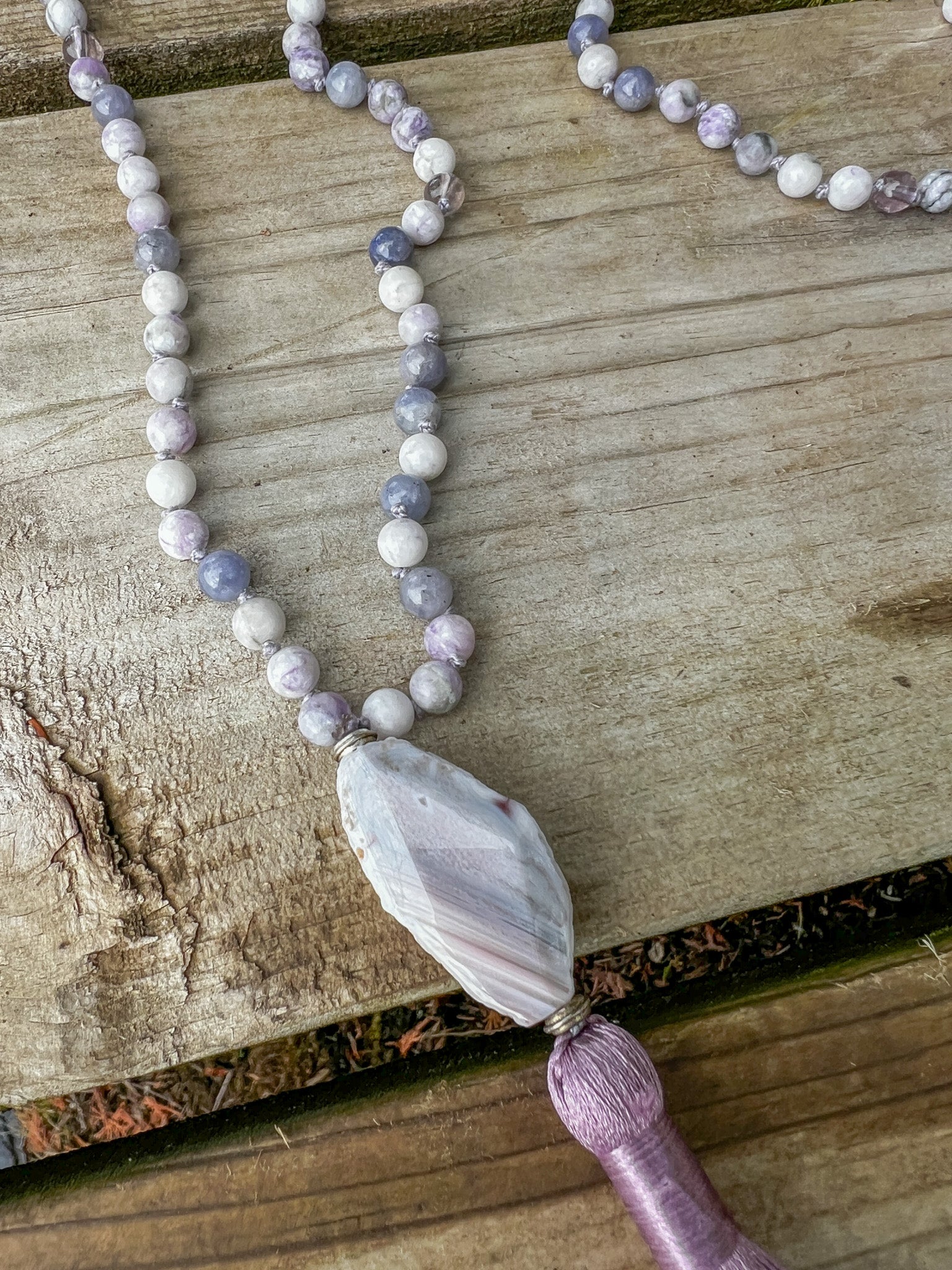 Morning Light Mala with Botswana Agate focal stone, lavender tassel, and hand-knotted gemstone beads.