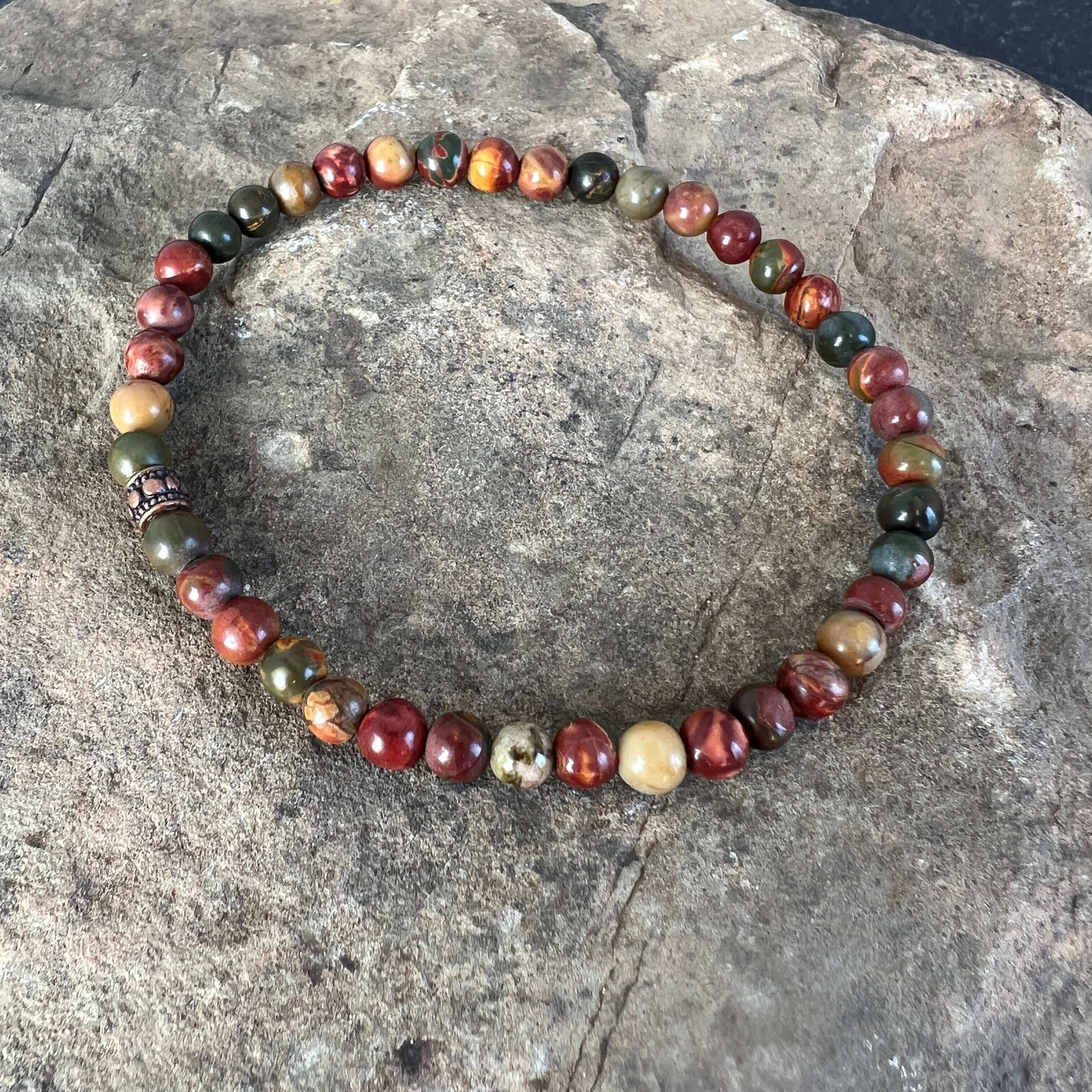 Red Creek Jasper Bracelet This bracelet is made with high-quality Red Creek Jasper gemstones which bring grounding energy to the wearer. Zodiac Signs: Aries and Scorpio. Chakras: Root and Sacral. Handmade with authentic crystals & gemstones in Minneapolis