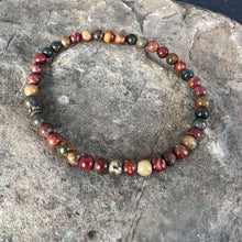 Load image into Gallery viewer, Red Creek Jasper Bracelet This bracelet is made with high-quality Red Creek Jasper gemstones which bring grounding energy to the wearer. Zodiac Signs: Aries and Scorpio. Chakras: Root and Sacral. Handmade with authentic crystals &amp; gemstones in Minneapolis
