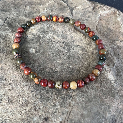 Red Creek Jasper Bracelet This bracelet is made with high-quality Red Creek Jasper gemstones which bring grounding energy to the wearer. Zodiac Signs: Aries and Scorpio. Chakras: Root and Sacral. Handmade with authentic crystals & gemstones in Minneapolis