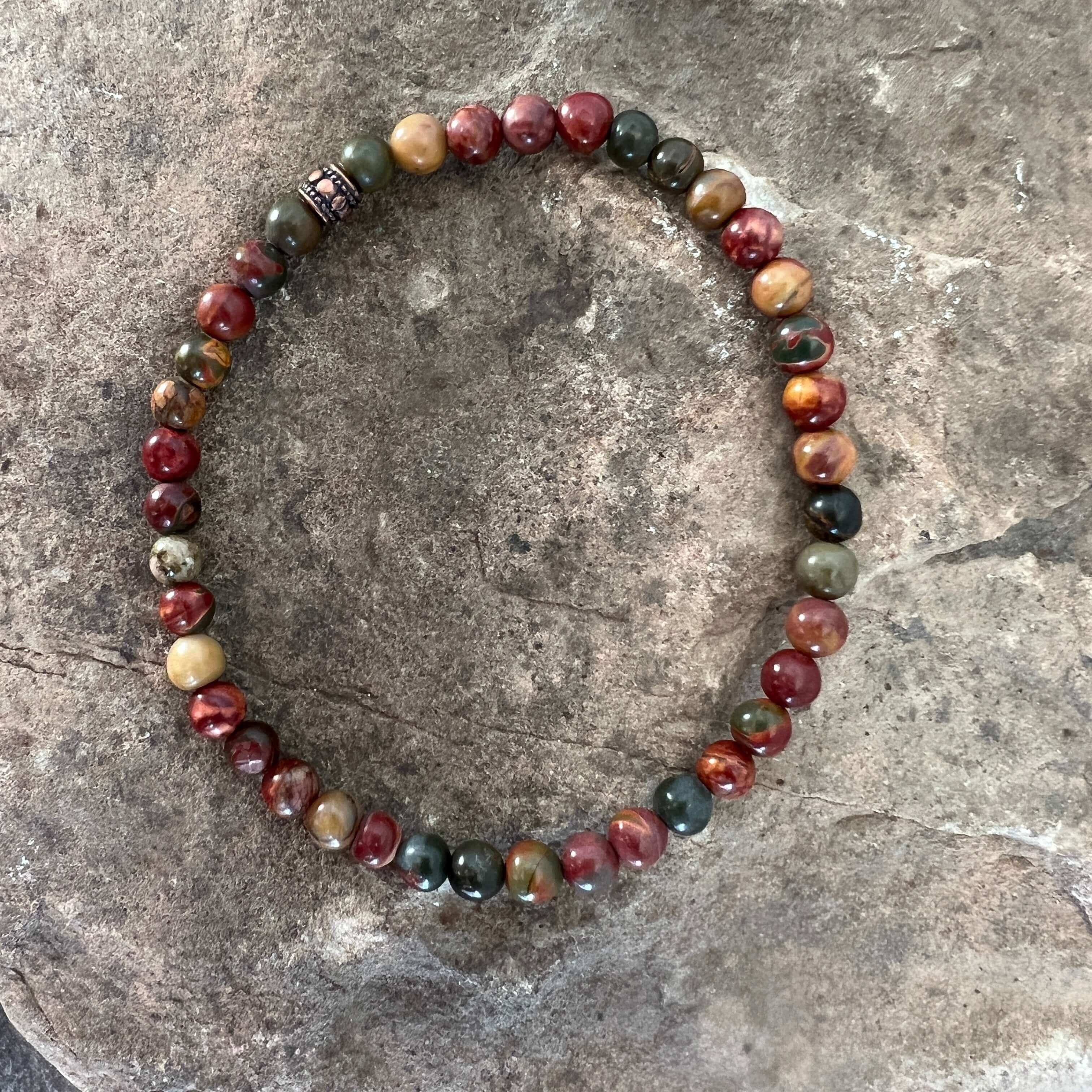 Red Creek Jasper Bracelet This bracelet is made with high-quality Red Creek Jasper gemstones which bring grounding energy to the wearer. Zodiac Signs: Aries and Scorpio. Chakras: Root and Sacral. Handmade with authentic crystals & gemstones in Minneapolis