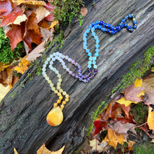 Load image into Gallery viewer, Sunrise Mala This mala is made with Jade, Moonstone, Rose Quartz, Aquamarine, and Lapis Lazuli gemstones which give the wearer a lift in energy. Zodiac Signs: Aries, Pisces, Sagittarius, Libra, Taurus. Chakras: Sacral, Solar Plexus, Throat, Crown, Third E
