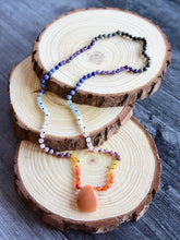 Load image into Gallery viewer, Sunset Mala This mala is made with authentic Carnelian, Yellow Jade, Lepidolite, Moonstone, Aquamarine, Sodalite, Amethyst, Larvikite, Red Aventurine, and Onyx gemstones which give the wearer a sense of being deeply rooted. Zodiac Signs: All. Chakras: All
