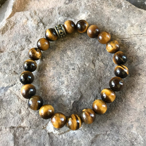 Tiger Eye Bead Bracelet This bracelet is made with high-quality Tiger Eye gemstones which bring protection and connection to the wearer. Chakras: Sacral, Solar Plexus, and Third Eye. Handmade with authentic crystals & gemstones in Minneapolis, MN.