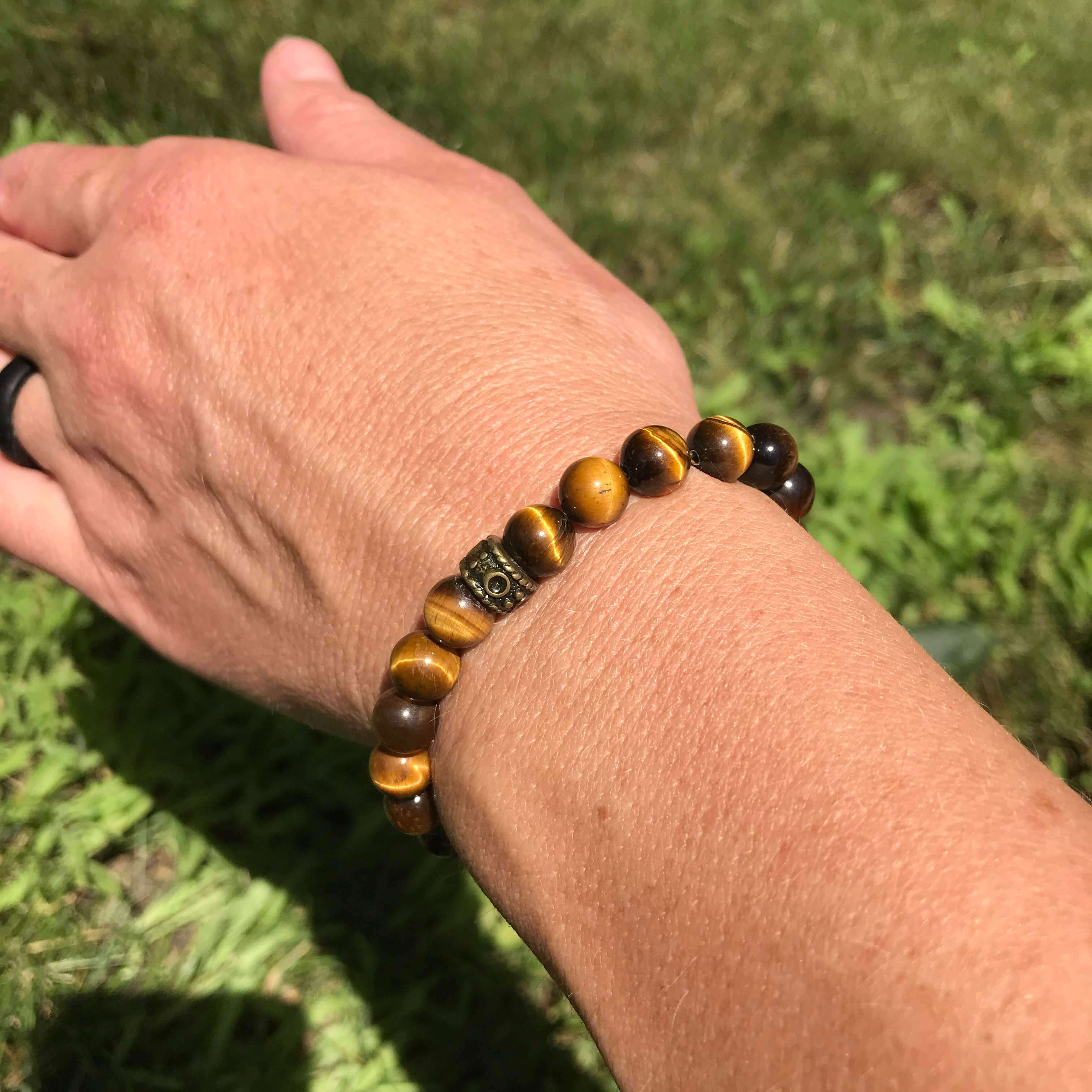 Tiger Eye Bead Bracelet This bracelet is made with high-quality Tiger Eye gemstones which bring protection and connection to the wearer. Chakras: Sacral, Solar Plexus, and Third Eye. Handmade with authentic crystals & gemstones in Minneapolis, MN.