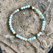 Load image into Gallery viewer, Black Gold Amazonite Bracelet This bracelet is made with high-quality Black Gold Amazonite stones which bring inspiration and calm to the wearer. Zodiac Sign: Virgo. Chakras: Heart and Throat. Handmade with authentic crystals and gemstones in Minneapolis,
