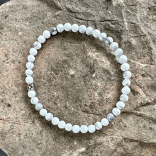 Load image into Gallery viewer, Howlite Bead Bracelet This bracelet is made with high-quality Howlite stones which bring calm and patience to the wearer. Zodiac Signs: Gemini and Virgo. Chakras: All. Handmade with authentic crystals &amp; gemstones in Minneapolis, MN
