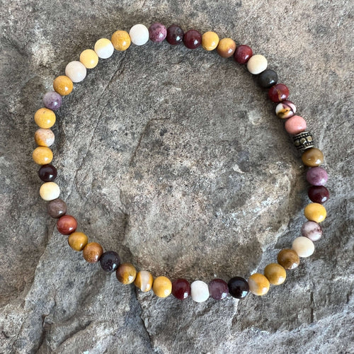 Mookaite Jasper Bracelet This bracelet is made with high-quality Mookaite gemstones which bring stability to the wearer. Zodiac Signs: Virgo and Scorpio. Chakras: Root, Sacral, and Solar Plexus. Handmade with authentic crystals & gemstones in Minneapolis,
