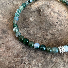 Load image into Gallery viewer, Moss Agate Bracelet This bracelet is made with high-quality Moss Agate gemstones which bring abundance and grounding energy to the wearer. Zodiac Sign: Virgo. Chakra: Heart. Handmade with authentic crystals &amp; gemstones in Minneapolis, MN.
