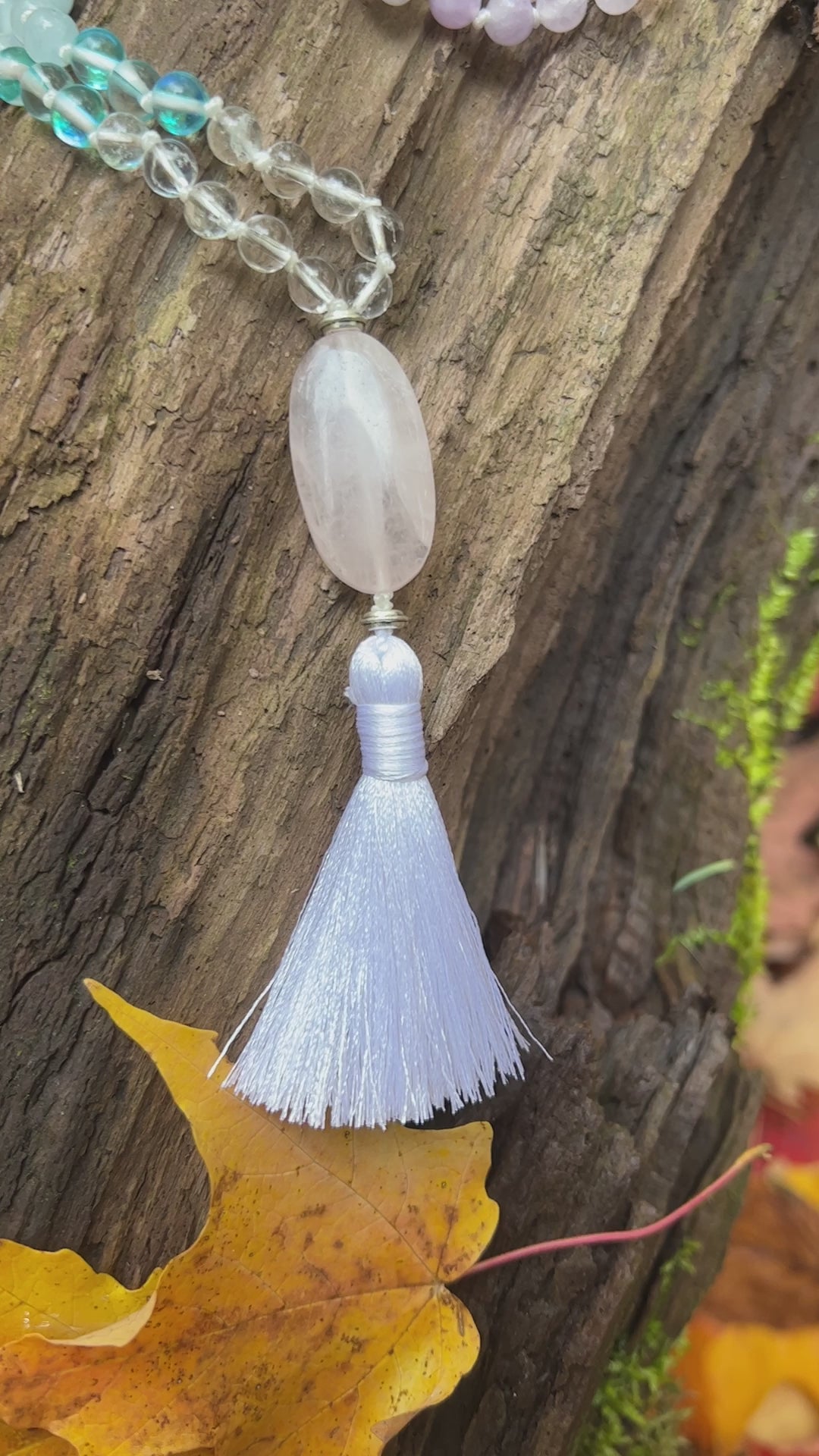 Clarity Mala with a woodland background.