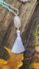 Clarity Mala with a woodland background.