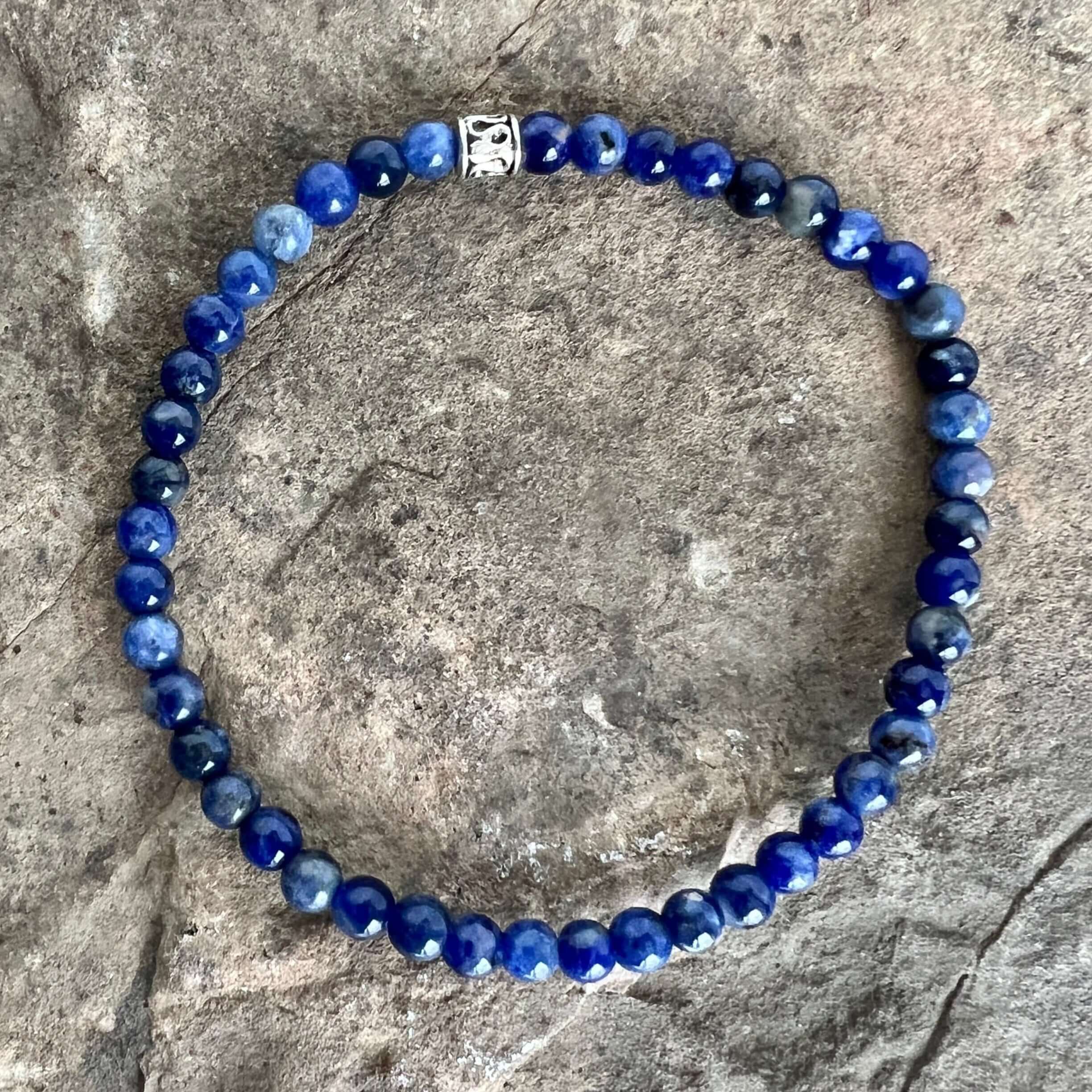 Sodalite Bracelet This bracelet is made with high-quality Sodalite gemstones which bring logic and intuition to the wearer. Zodiac Signs: Virgo and Sagittarius. Chakras: Throat and Third Eye. Handmade with authentic crystals & gemstones in Minneapolis, MN