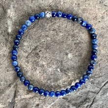 Load image into Gallery viewer, Sodalite Bracelet This bracelet is made with high-quality Sodalite gemstones which bring logic and intuition to the wearer. Zodiac Signs: Virgo and Sagittarius. Chakras: Throat and Third Eye. Handmade with authentic crystals &amp; gemstones in Minneapolis, MN
