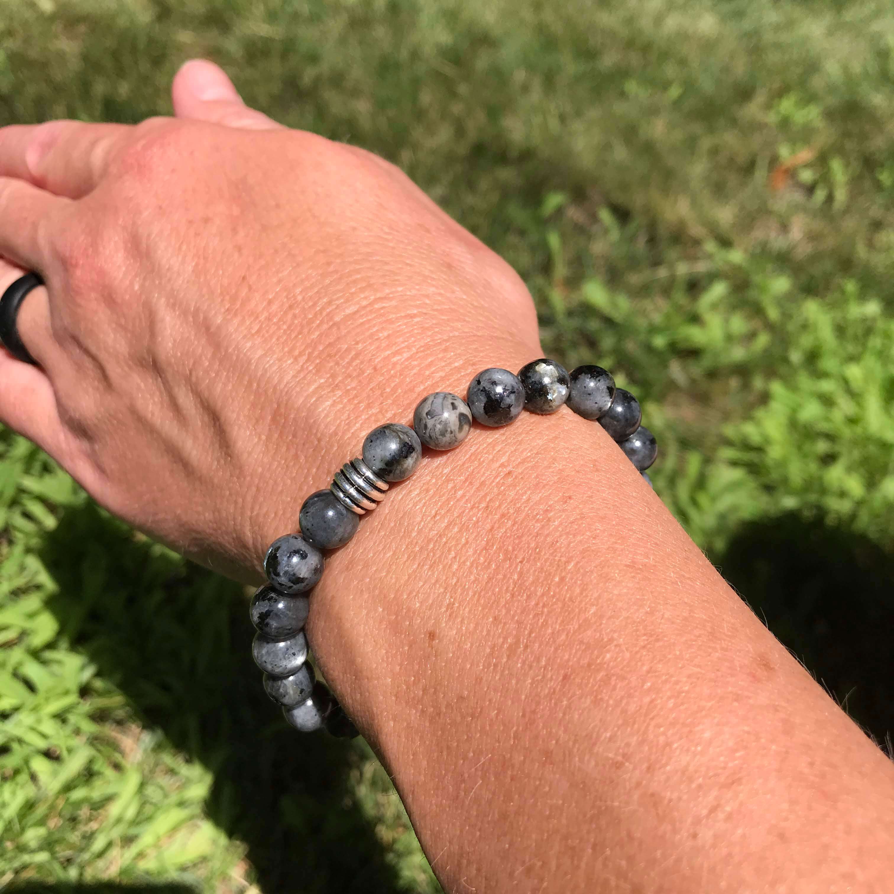 Larvikite Bracelet This bracelet is made with high-quality Larvikite stones which bring protection and a strong connection to nature to the wearer. Zodiac Signs: Aquarius. Chakras: Root and Third Eye. Handmade with authentic crystals & gemstones in Minnea